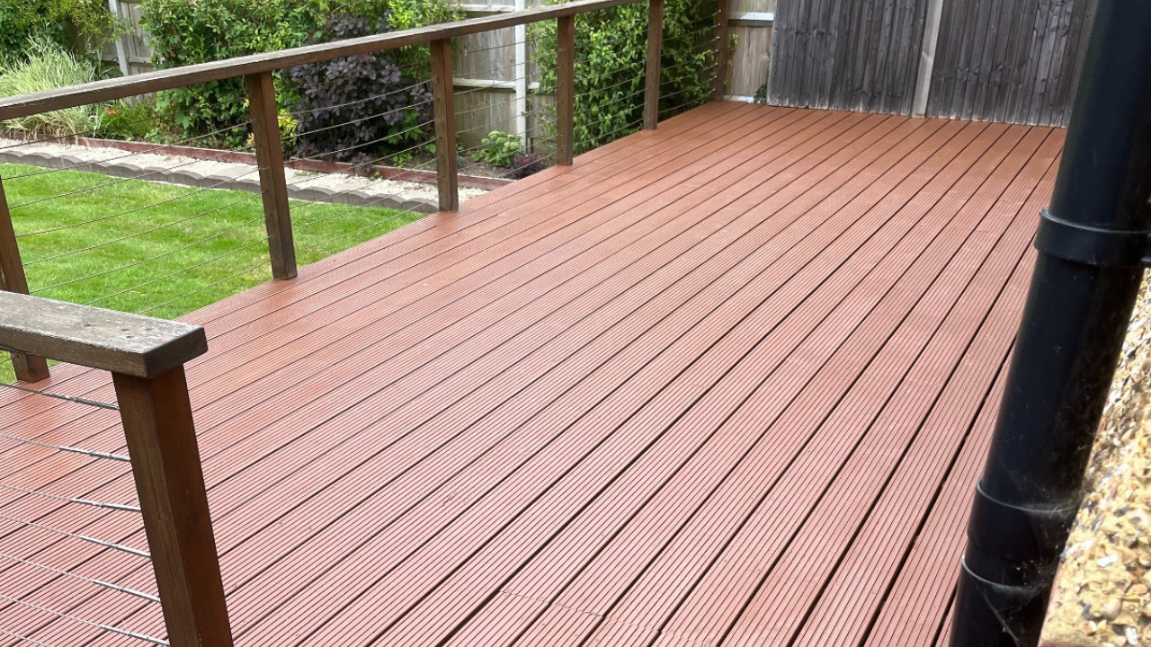 Freshly restored grooved softwood timber garden decking floor after Deck Sanding in South Woodford, creating a clean and even outdoor surface.